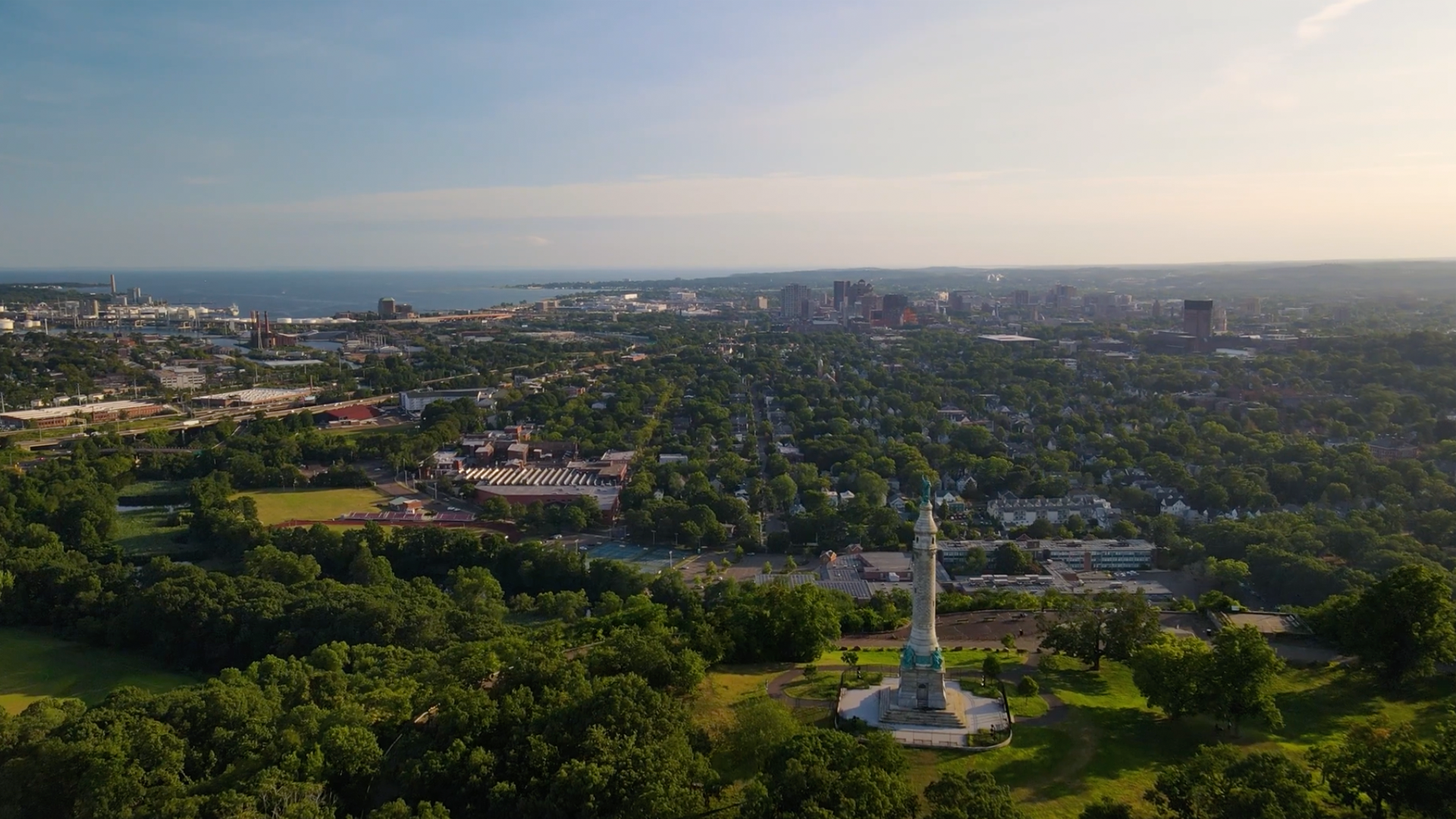 Aerial view of New Haven, showing trees and an urban cityscape
